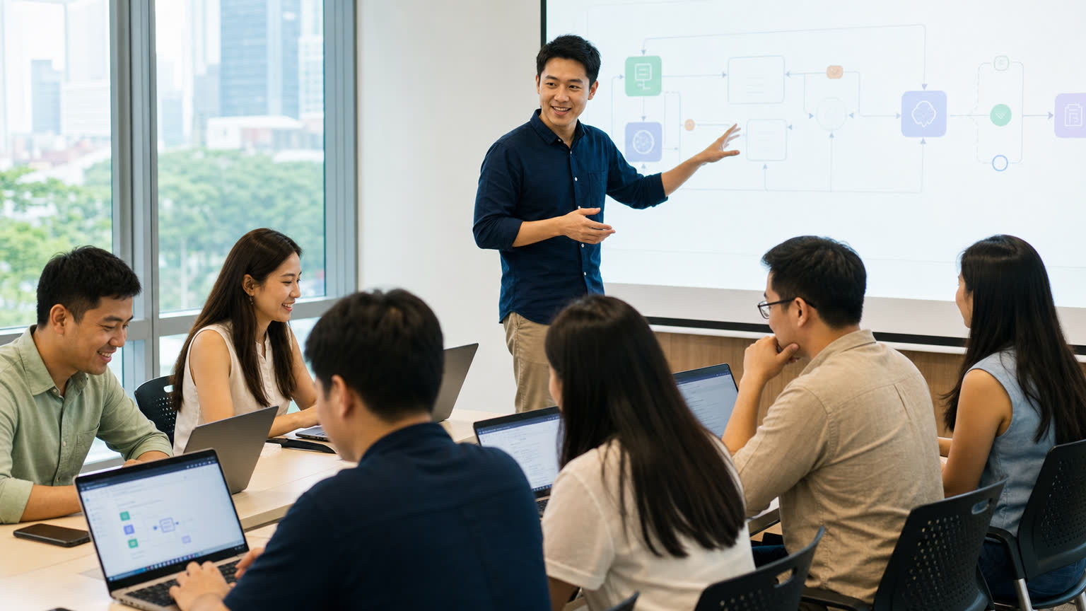 Singaporean instructor guiding Asian learners through a hands-on AI agents workshop